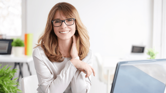 Woman with glasses smiling 