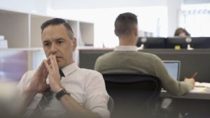 Man sitting and pondering 
