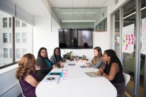 workers around a conference table 